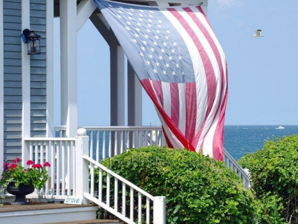 American Flag Hanging on A Porch