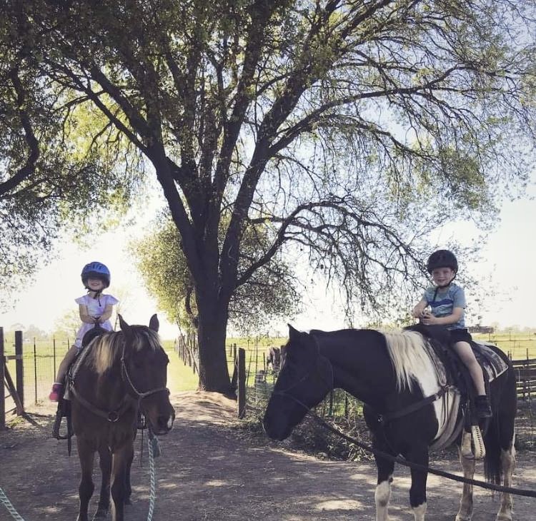 Two Kids Riding a Horse