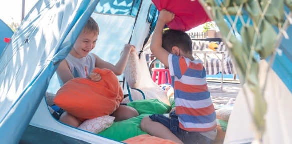 Boys Playing Inside A Tent